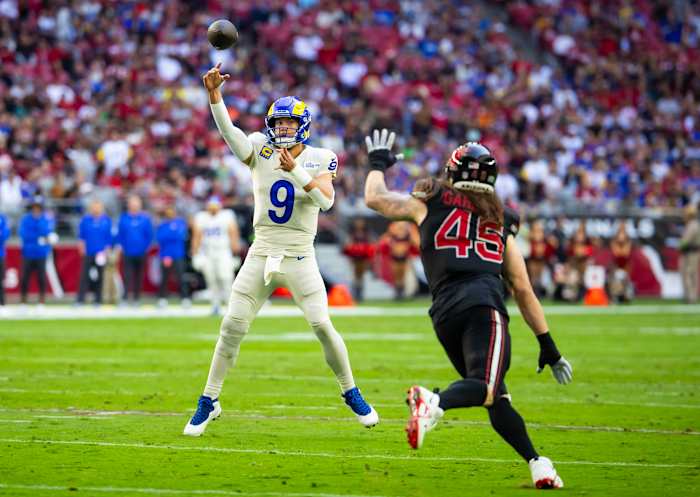 Nov 26, 2023; Glendale, Arizona, USA; Los Angeles Rams quarterback Matthew Stafford (9) throws a touchdown pass against the Arizona Cardinals in the first half at State Farm Stadium. Mandatory Credit: Mark J. Rebilas-USA TODAY Sports